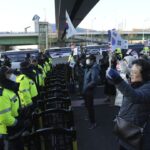 South Korea’s impeached president defies warrant in hourslong standoff