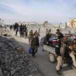 Palestinians trek across rubble to return to their homes as Gaza ceasefire takes hold