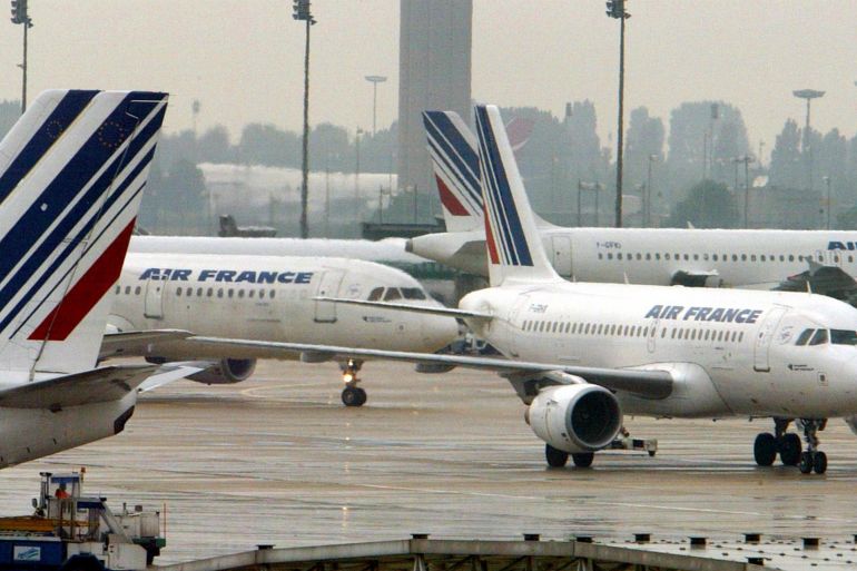 Air France planes seen at Paris's Roissy-Charles de Gaulle airport, July 30, 2002, after the French government announced a plan to cut its majority stake in the airline from 54,4 to less than 20 per cent. [Air France shares rose 6% after French Finance Minister Francis Mer said that the privatisation of the airline should take place by late this year or early 2003.]