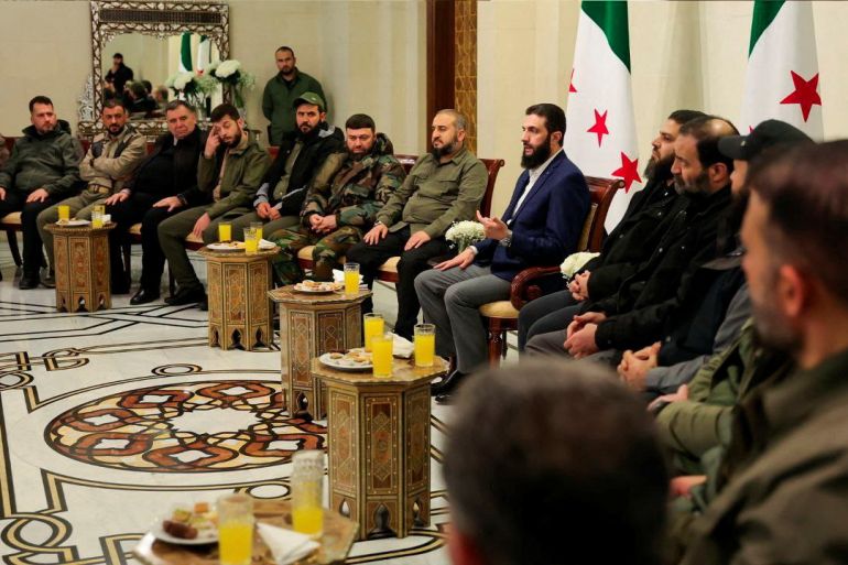 Syria's de facto leader Ahmed al-Sharaa attends a meeting with former rebel faction chiefs, as he reached an agreement with them to dissolve all groups and consolidate them under the Defence Ministry, according to a statement from the new administration, in Damascus, Syria, in this handout image released on December 24, 2024. SANA/Handout via REUTERS ATTENTION EDITORS - THIS IMAGE WAS PROVIDED BY A THIRD PARTY. REUTERS IS UNABLE TO INDEPENDENTLY VERIFY THIS IMAGE.