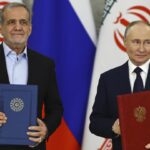 Russia and Iran sign a partnership treaty to deepen their ties in the face of Western sanctions