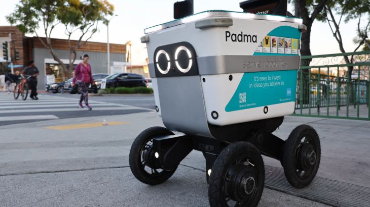 WEST HOLLYWOOD, CALIFORNIA - MARCH 19: A Serve Robotics autonomous delivery robot, which utilizes AI and is emissions-free, operates on a sidewalk on March 19, 2024 in West Hollywood, California. Several companies are operating self-driving sidewalk vehicles which deliver food and other smaller items in parts of the Los Angeles area. (Photo by Mario Tama/Getty Images)