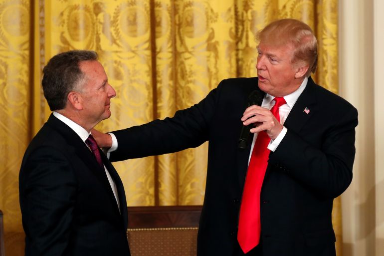 U.S. President Donald Trump puts his hand on the shoulder of his friend Steve Witkoff, whose son Andrew died from a drug overdose, during at an opioid summit being held at the White House in Washington, U.S., March 1, 2018. REUTERS/Kevin Lamarque