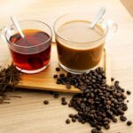 Hot tea and coffee With tea leaves and coffee beans المصدر : ادوبي ستوك