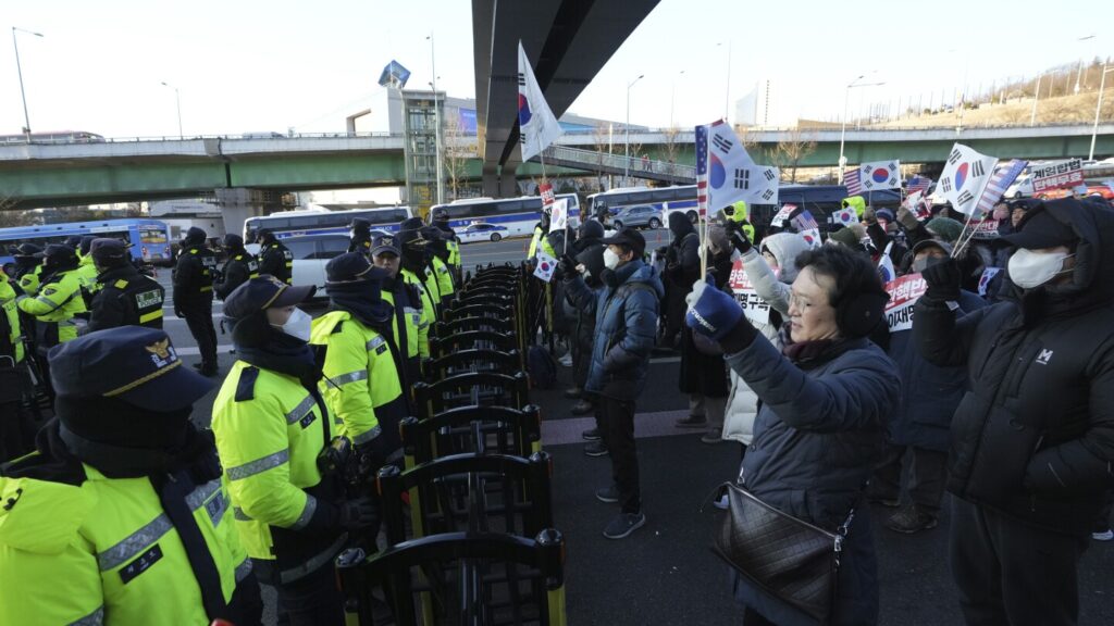 South Korea’s impeached president defies warrant in hourslong standoff