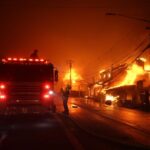 epa11812623 Firefighters work as the Palisades wildfire burns multiple structures along the Pacific Coast Highway in Malibu, California, USA, 07 January 2025. California Governor Gavin Newsom declared a state of emergency as about 30,000 people were ordered to evacuate due to a large wildfire called the 'Palisades Fire' in the Palisades that has already burned about 3,000 acres, according to the California Department of Forestry and Fire Protection, CAL FIRE. EPA-EFE/ALLISON DINNER