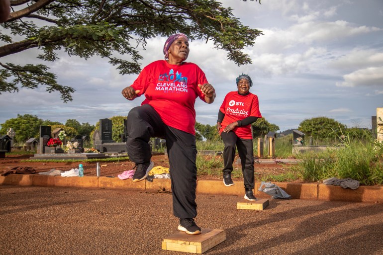 women exercise with the commandos fitness club at the warren hills cemetery in harare, zimbabwe, saturday, jan. 18, 2025. ( ap photo/aaron ufumeli)