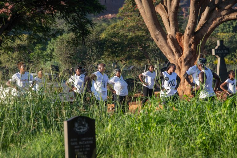 members of the commandos fitness club exercise at the warren hills cemetery in harare, zimbabwe, saturday, jan. 18, 2025. ( ap photo/aaron ufumeli)